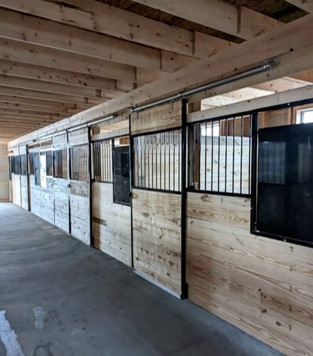 Durable farm building designed for equipment storage and livestock