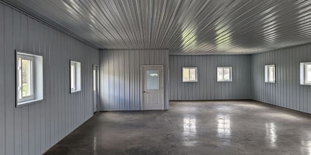 Finished pole barn with custom trim and doors